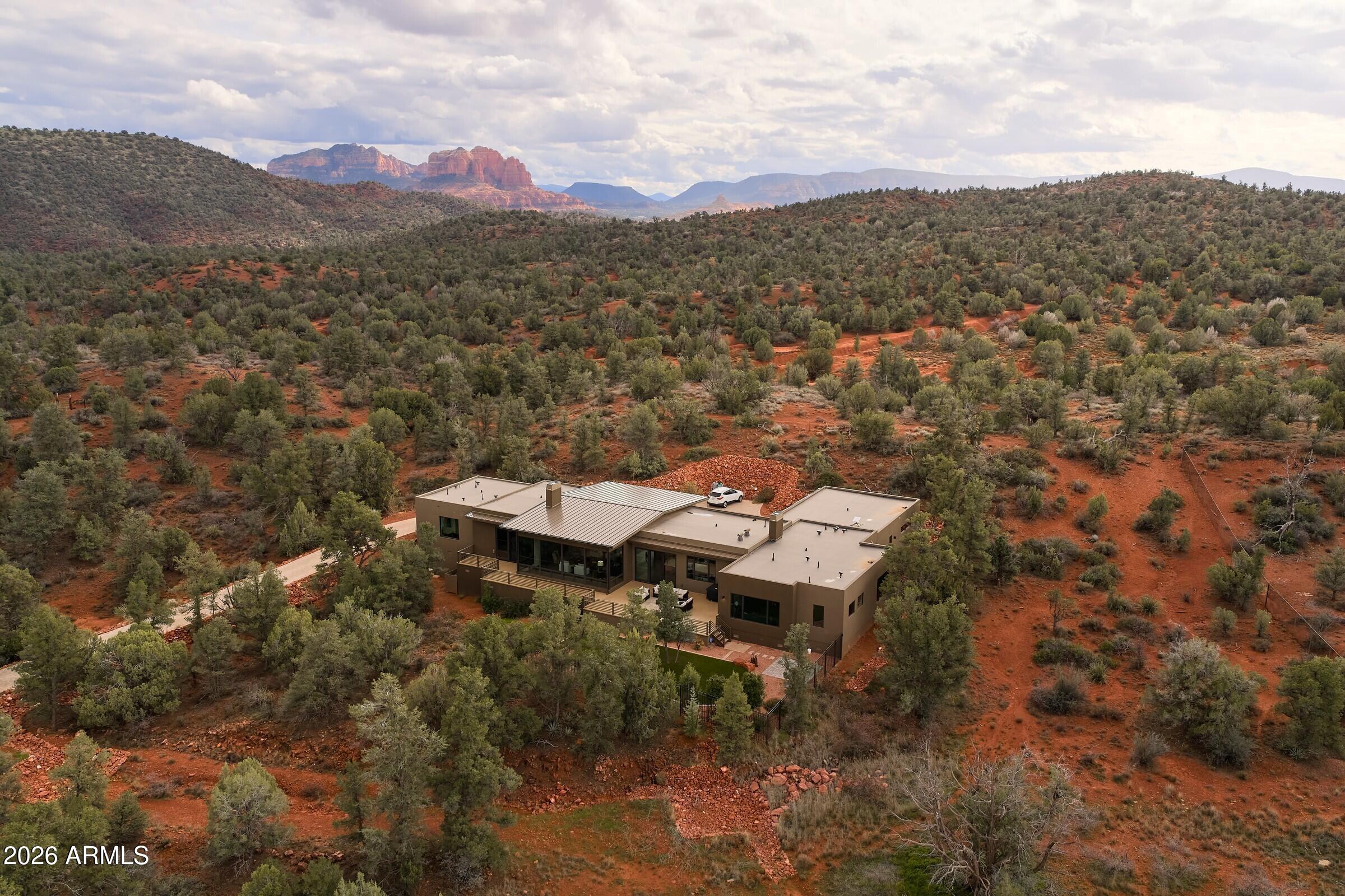 2925 Red Hawk Lane Sedona, AZ 86336 - Photo 3 of 35 a view of a terrace with a table and chairs