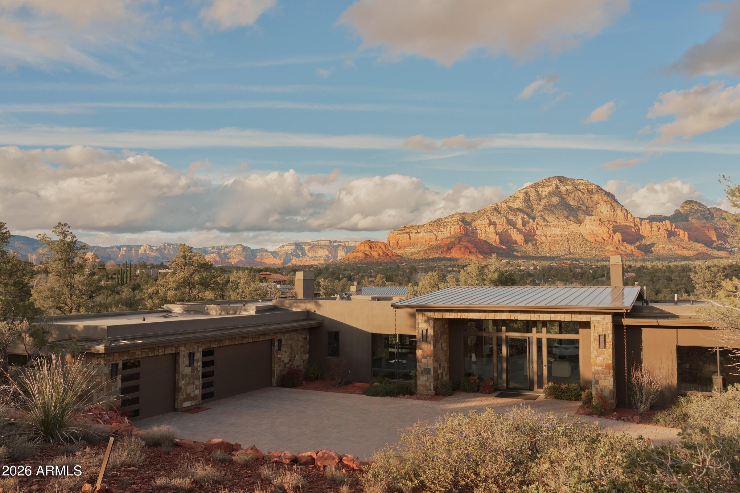 2925 Red Hawk Lane Sedona, AZ 86336 - Photo 33 of 35 a view of a terrace with a garden and trees