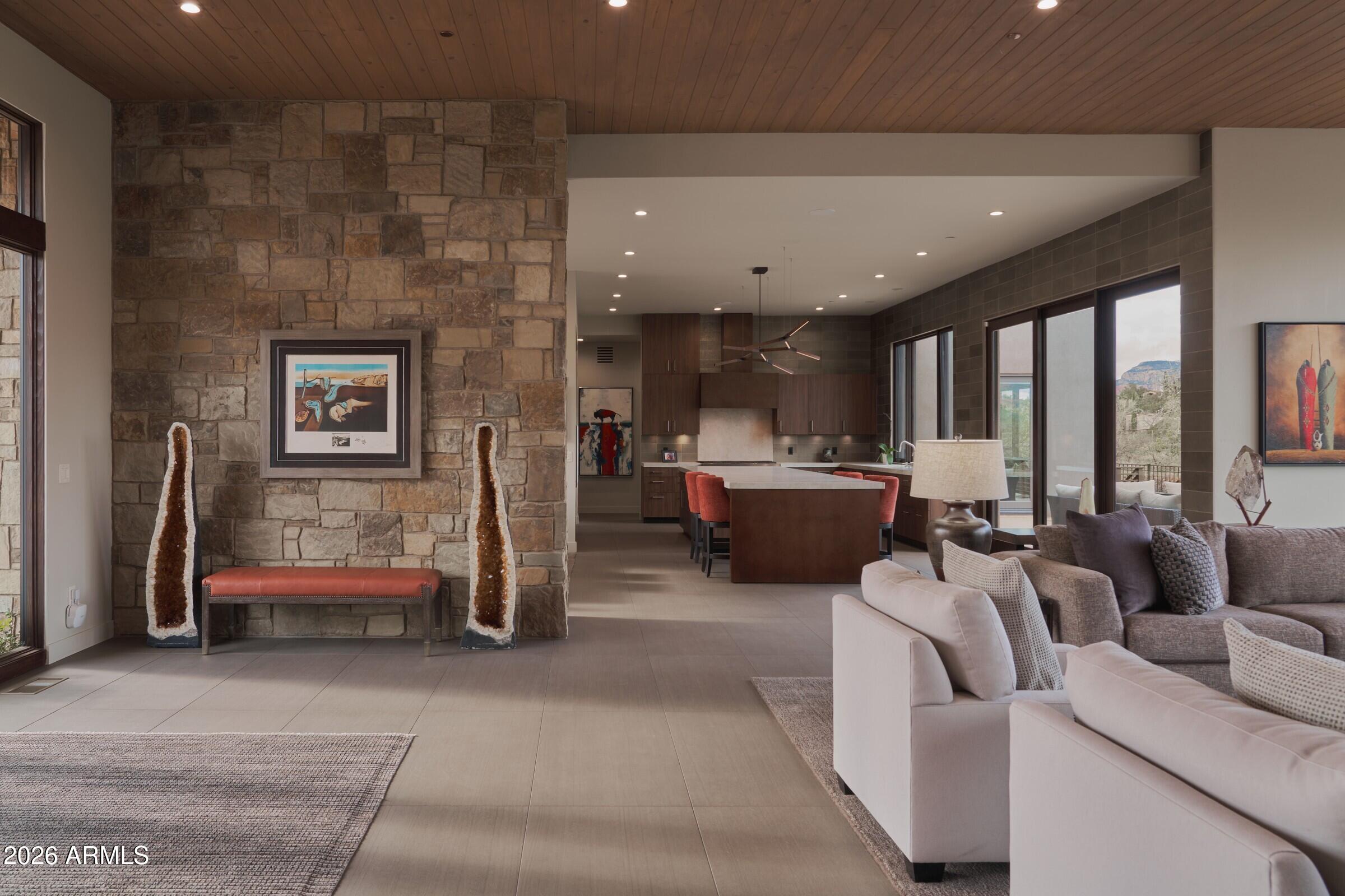 2925 Red Hawk Lane Sedona, AZ 86336 - Photo 5 of 35 a living room with furniture and a large window