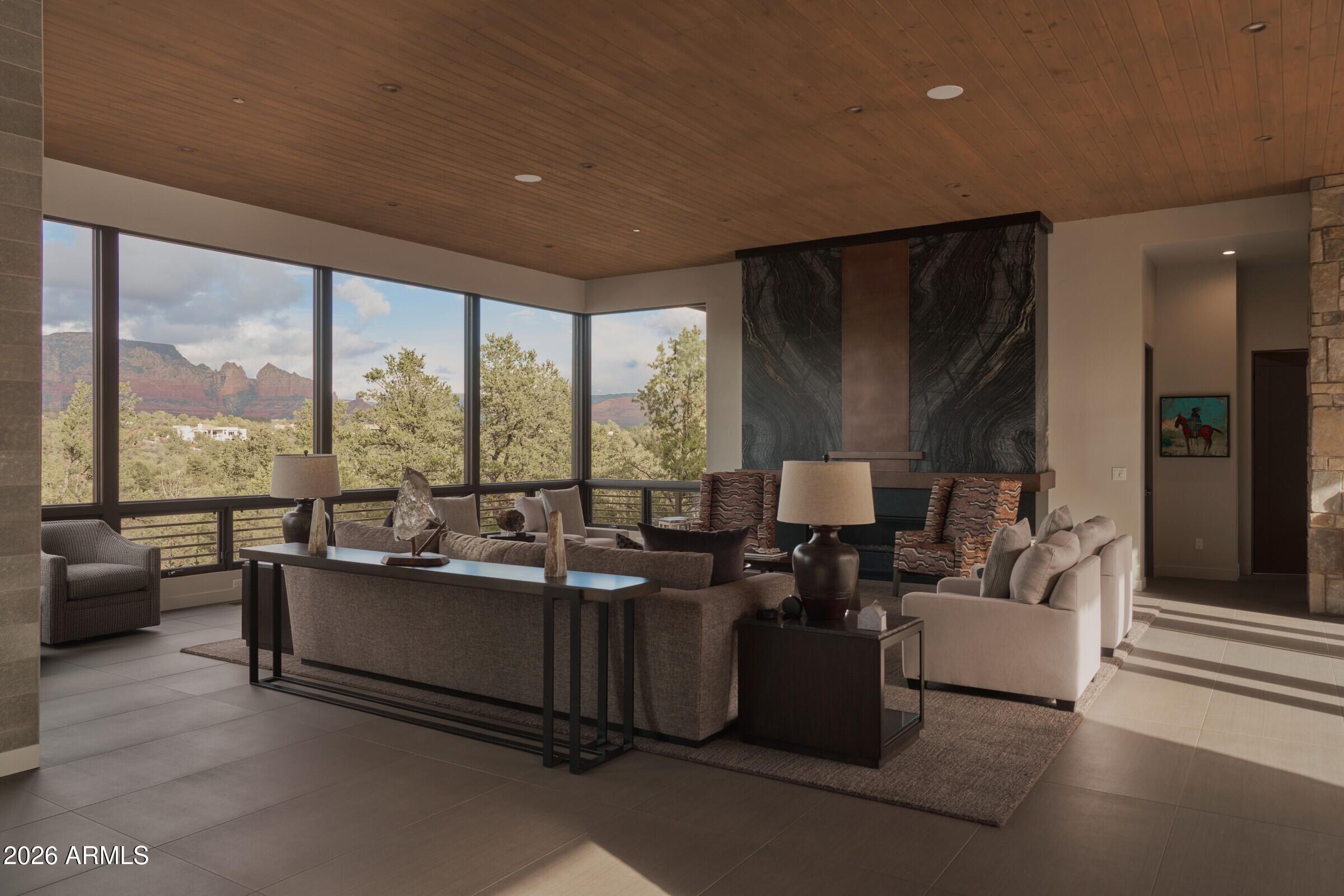 2925 Red Hawk Lane Sedona, AZ 86336 - Photo 7 of 35 a living room with furniture and large windows