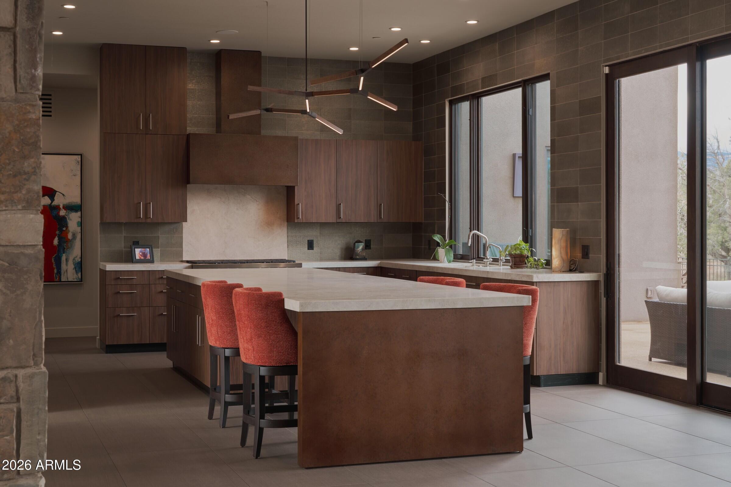 2925 Red Hawk Lane Sedona, AZ 86336 - Photo 9 of 35 a kitchen with stainless steel appliances granite countertop a stove a sink and a refrigerator