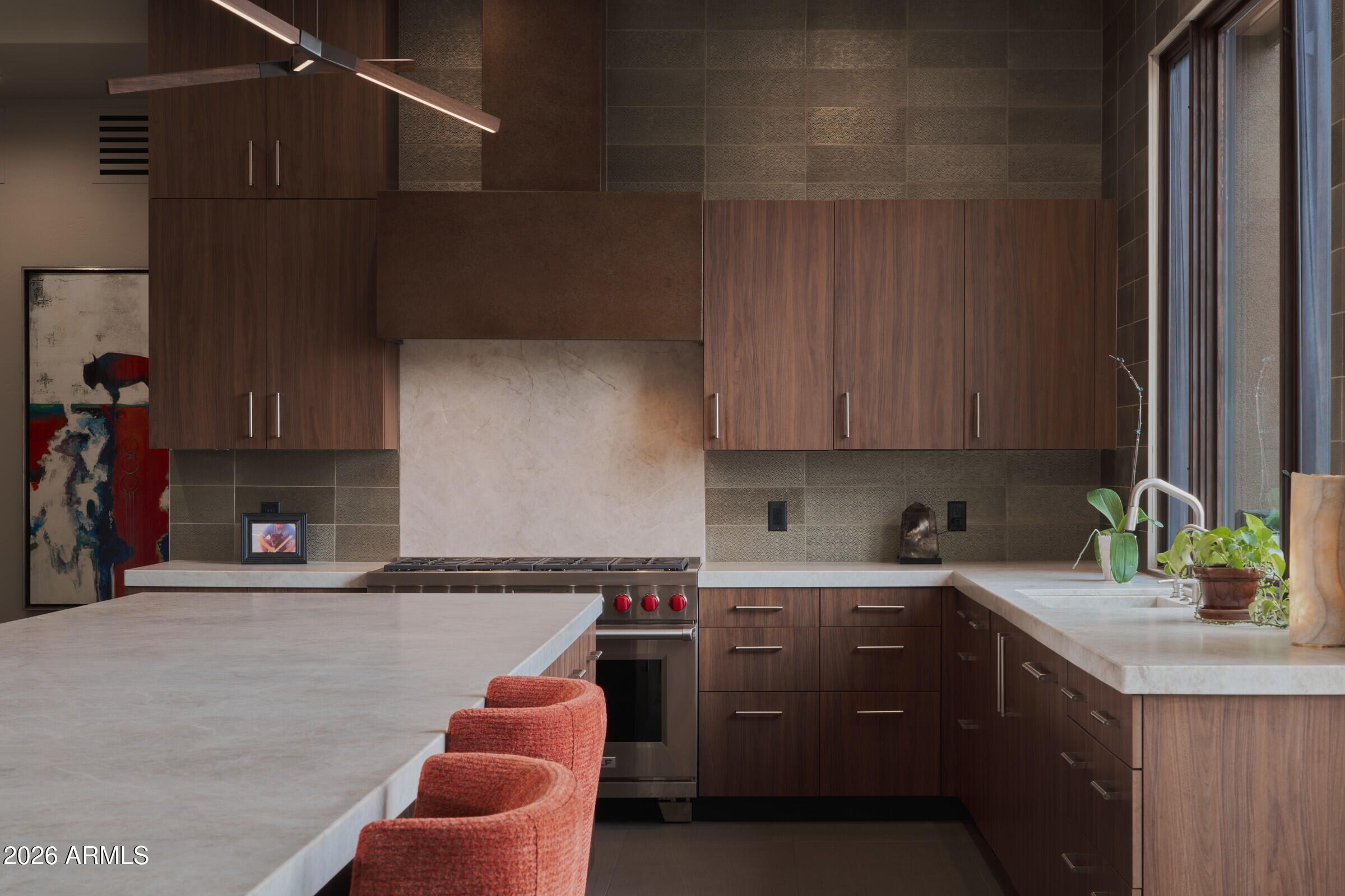 2925 Red Hawk Lane Sedona, AZ 86336 - Photo 10 of 35 a kitchen with stainless steel appliances granite countertop a sink stove and cabinets