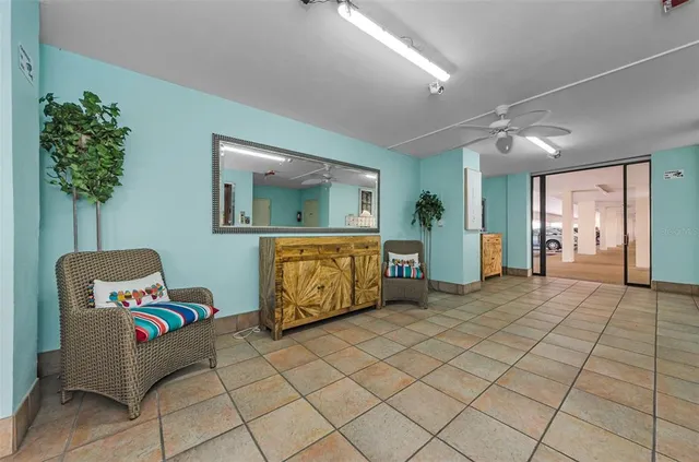 a bedroom with furniture and a mirror