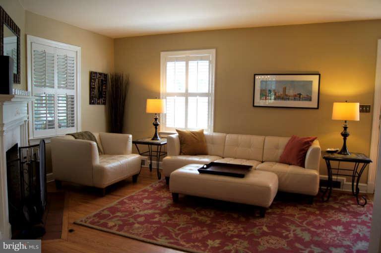 306 Worthington Road Baltimore, MD 21286 - Photo 3 of 23 Hardwood floors with fireplace