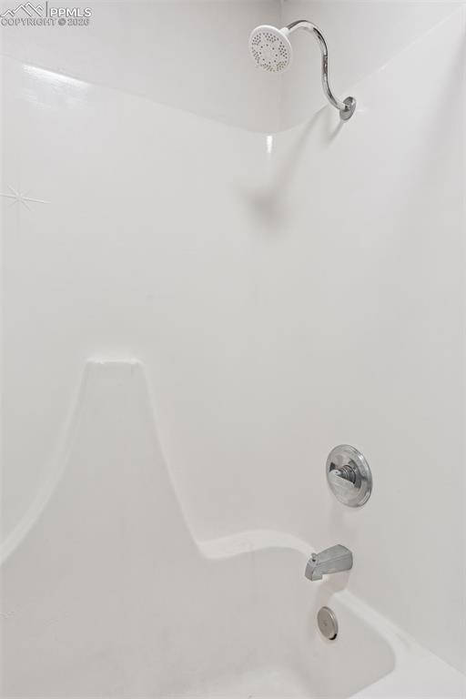 16880-1688 Old Pueblo Road Fountain, CO 80817 - Photo 14 of 47 En-suite bathroom shower and tub combination serving the adjacent bedroom