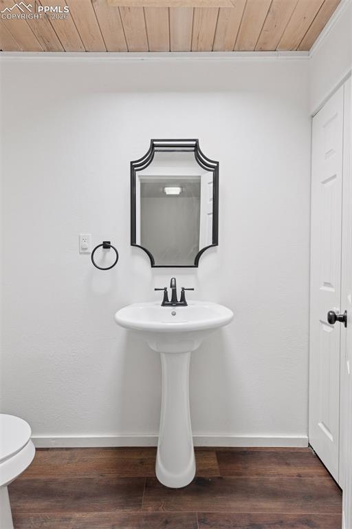 16880-1688 Old Pueblo Road Fountain, CO 80817 - Photo 19 of 47 Half bath featuring pedestal sink, mirror, and overhead lighting.
