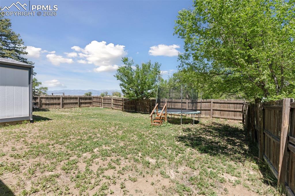 16880-1688 Old Pueblo Road Fountain, CO 80817 - Photo 22 of 47 Fenced yard area associated with the second single-family residence, offering private outdoor space w/views of the mountains in the distance.