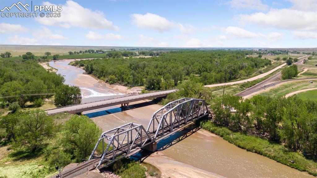 16880-1688 Old Pueblo Road Fountain, CO 80817 - Photo 6 of 47 View near a corner of the property, illustrating Fountain Creek, adjacent transportation corridors, and the property’s strategic positioning within the surrounding landscape