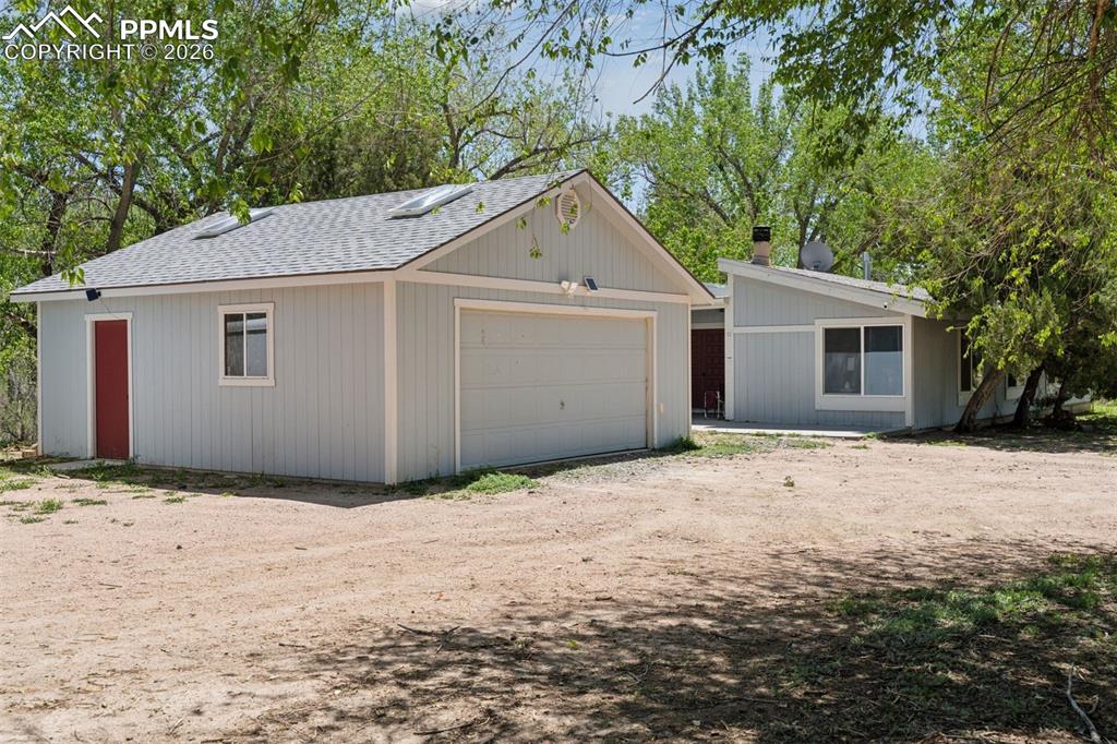 16880-1688 Old Pueblo Road Fountain, CO 80817 - Photo 7 of 47 Exterior view of the 5-bedroom, 2.5-bath single-family residence with detached two-car garage (16885 Old Pueblo Rd)