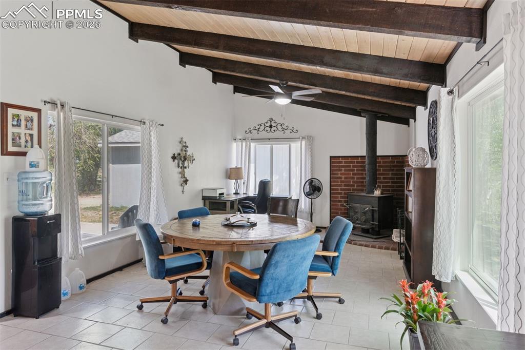 16880-1688 Old Pueblo Road Fountain, CO 80817 - Photo 10 of 47 Alternate interior view of the 16885 highlighting the open addtiional living or dining area, vaulted wood ceilings with exposed beams, and natural light.