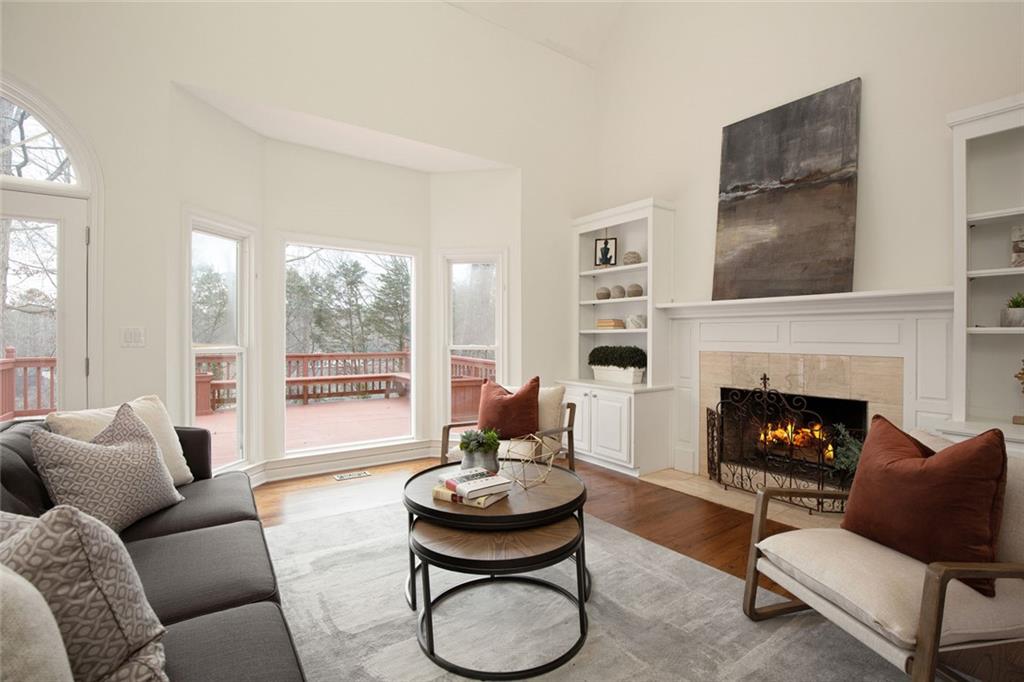715 Winterwind Way Roswell, GA 30075 - Photo 12 of 83 a living room with furniture and a fireplace
