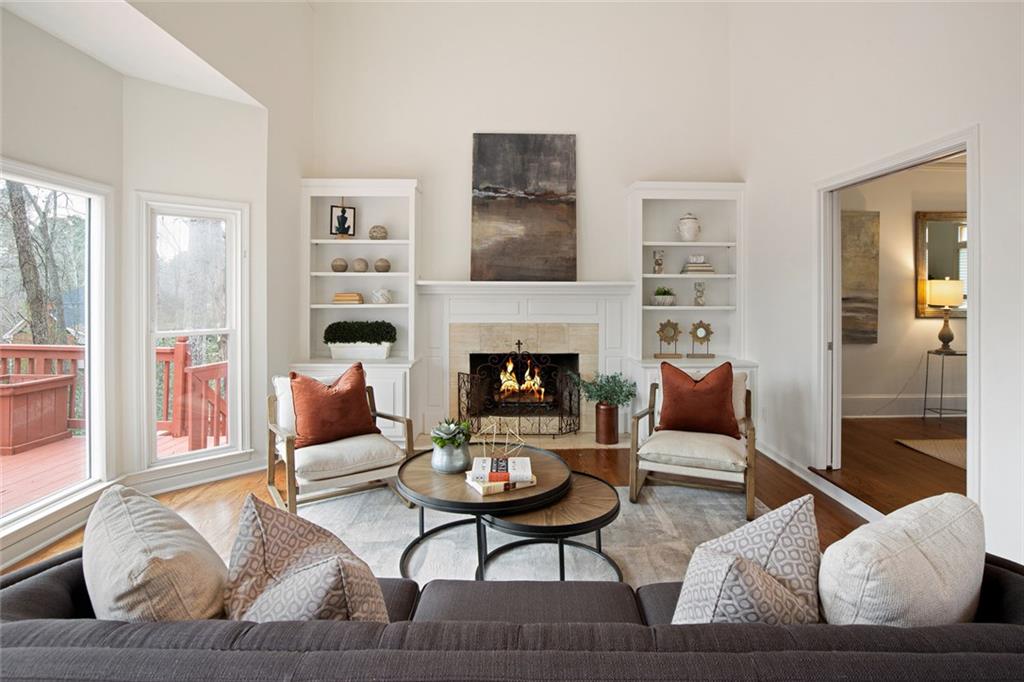 715 Winterwind Way Roswell, GA 30075 - Photo 13 of 83 a living room with furniture and a fireplace