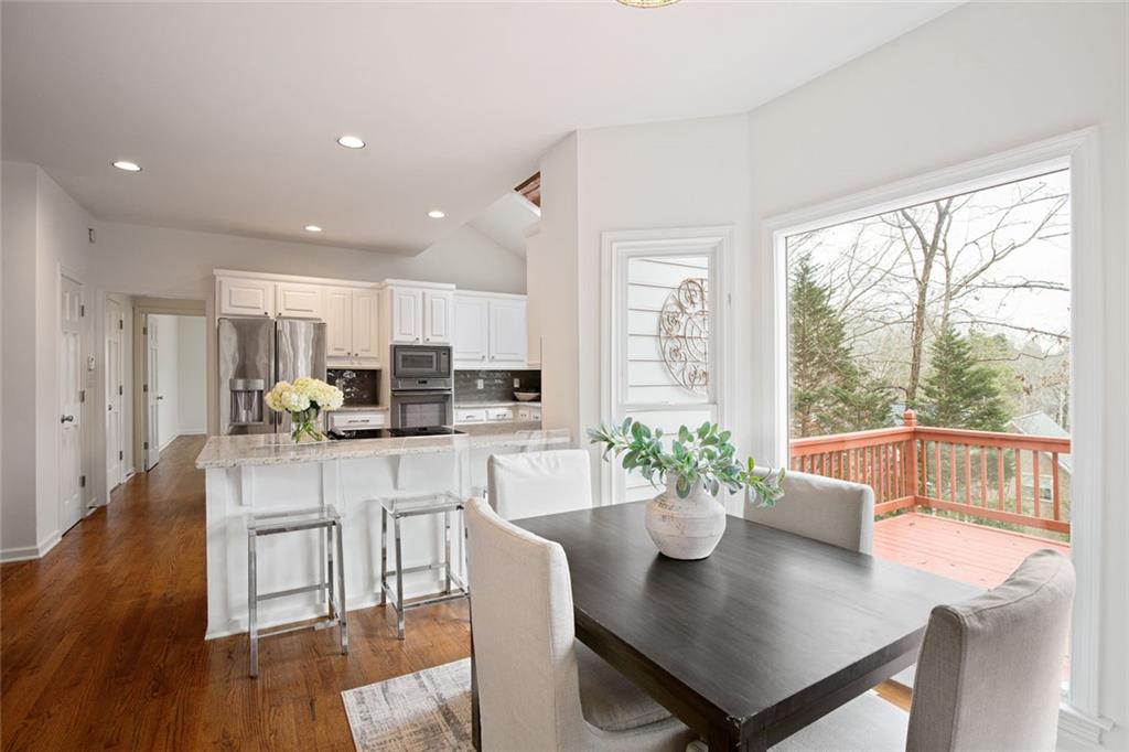 715 Winterwind Way Roswell, GA 30075 - Photo 16 of 83 a kitchen with a table and chairs
