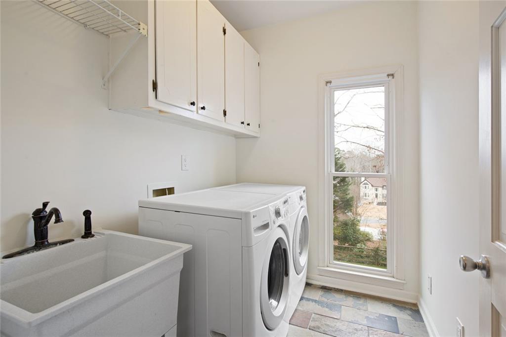 715 Winterwind Way Roswell, GA 30075 - Photo 26 of 83 a utility room with dryer and washer