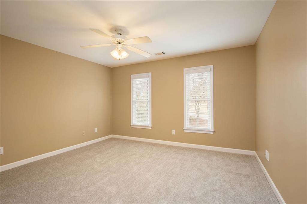 715 Winterwind Way Roswell, GA 30075 - Photo 29 of 83 a view of an empty room with a window