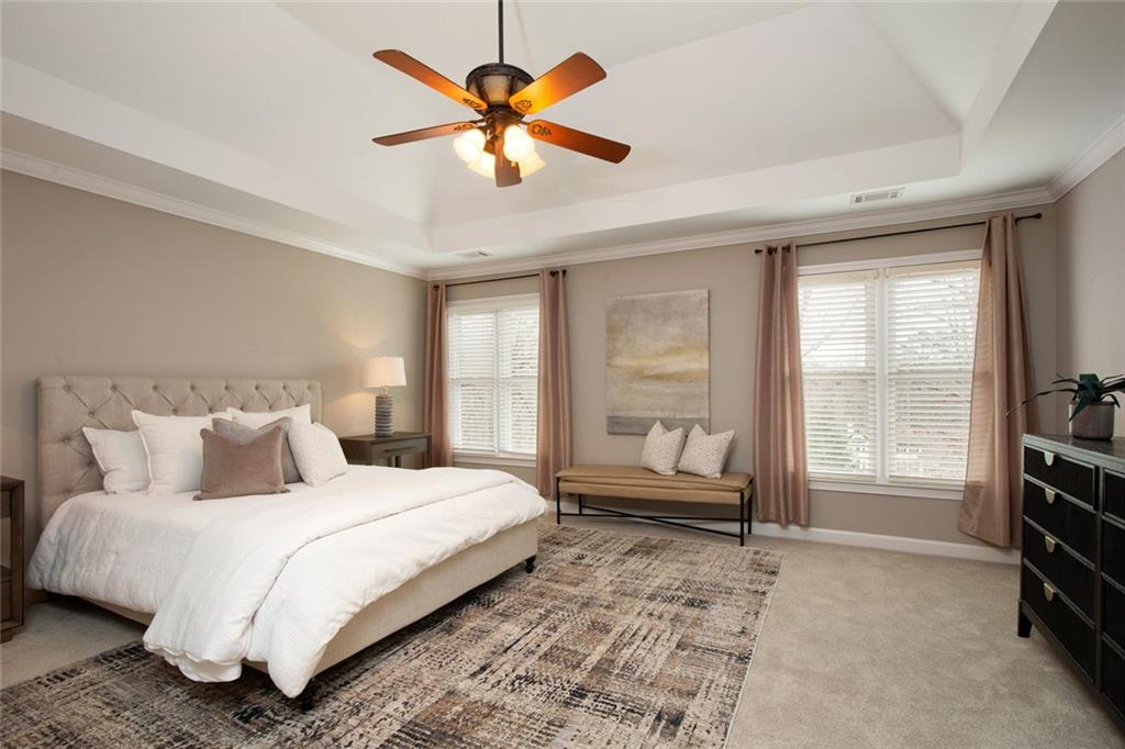 715 Winterwind Way Roswell, GA 30075 - Photo 35 of 83 a bedroom with a large bed and a window