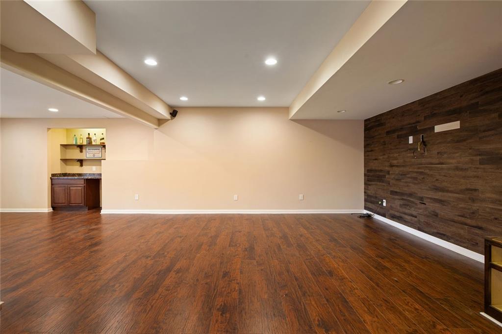 715 Winterwind Way Roswell, GA 30075 - Photo 39 of 83 a view of an empty room with wooden floor