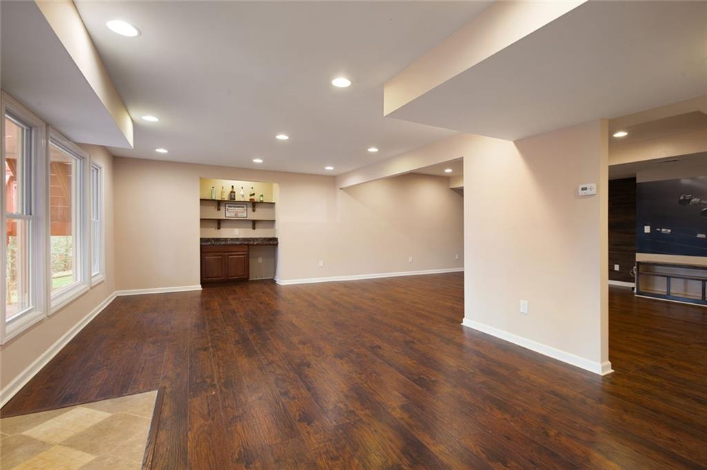 715 Winterwind Way Roswell, GA 30075 - Photo 42 of 83 a view of empty room with wooden floor