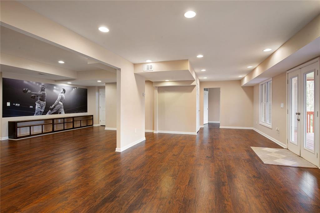 715 Winterwind Way Roswell, GA 30075 - Photo 44 of 83 a view of an empty room with wooden floor