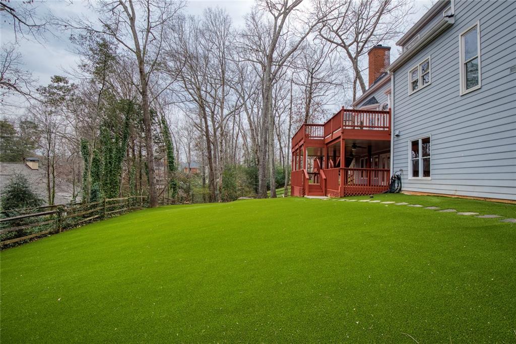 715 Winterwind Way Roswell, GA 30075 - Photo 60 of 83 a view of a house with a yard porch and sitting area