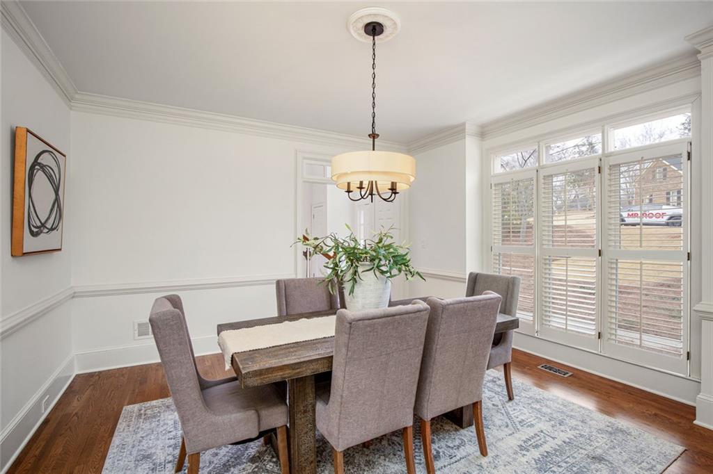 715 Winterwind Way Roswell, GA 30075 - Photo 6 of 83 a view of a dining room with furniture window and wooden floor