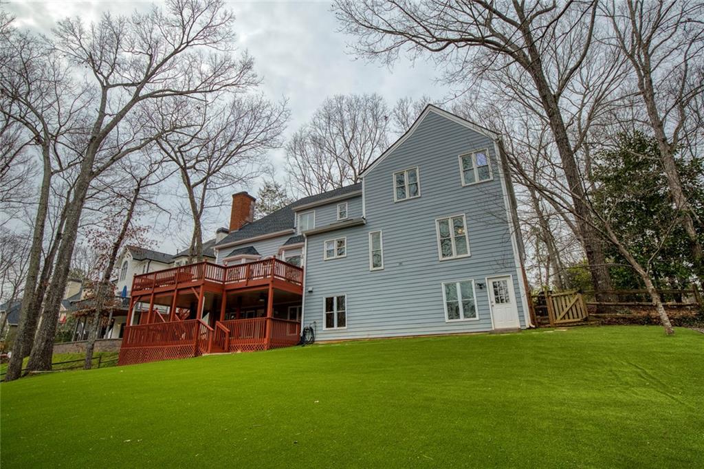 715 Winterwind Way Roswell, GA 30075 - Photo 61 of 83 a front view of a house with a garden