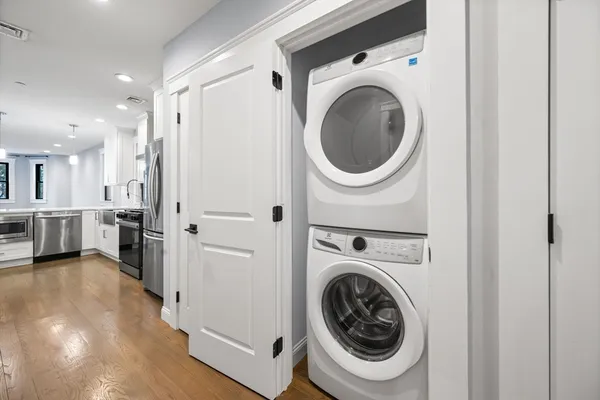a view of a hallway with washer and dryer