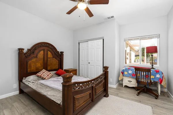 a bedroom with a bed and a window