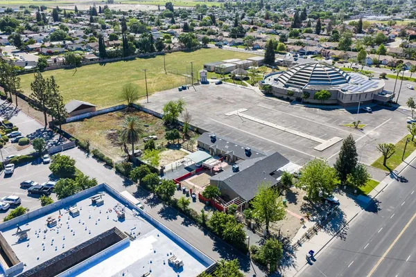 an aerial view of a house with a yard and garden