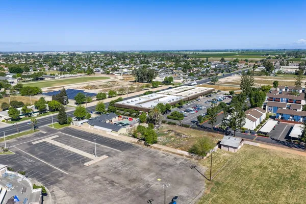 an aerial view of residential houses with outdoor space