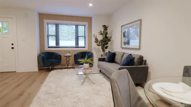 a living room with furniture and window