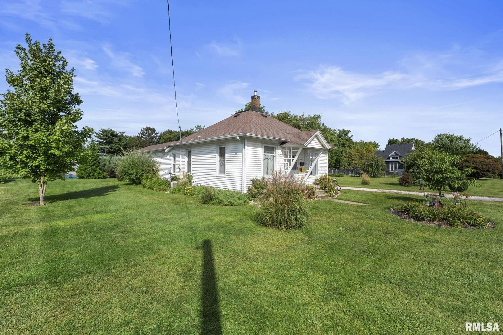 607 Northwest 8th Avenue Aledo, IL 61231 - Photo 22 of 22 a front view of a house with a yard