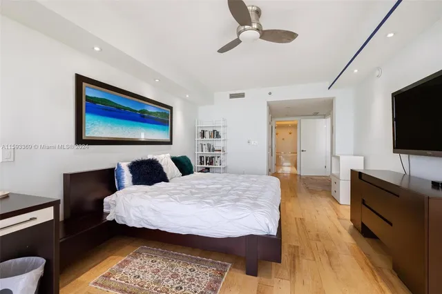 a spacious bedroom with a bed and a couch