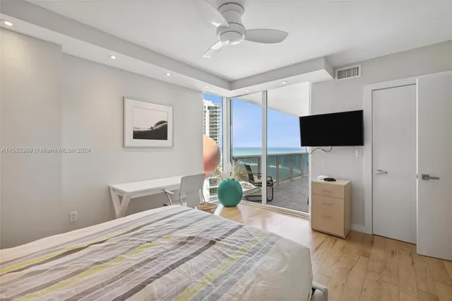 a bathroom with a granite countertop sink a mirror and a bathtub