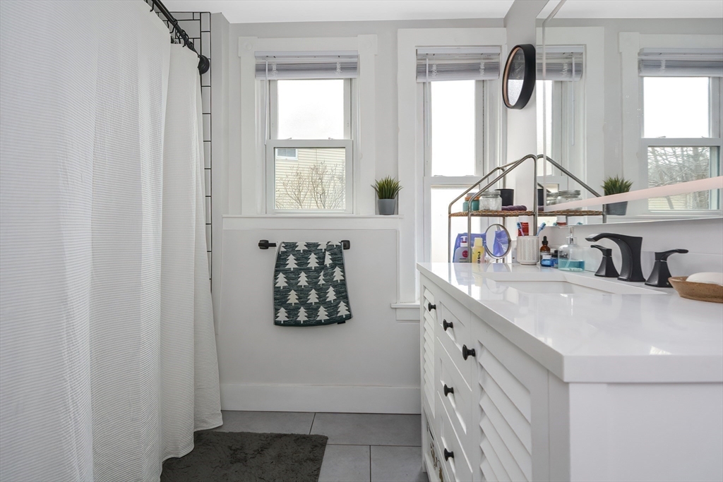 21 Cemetery Street, Unit 21 Hopedale, MA 01747 - Photo 14 of 19 a kitchen with cabinets and window