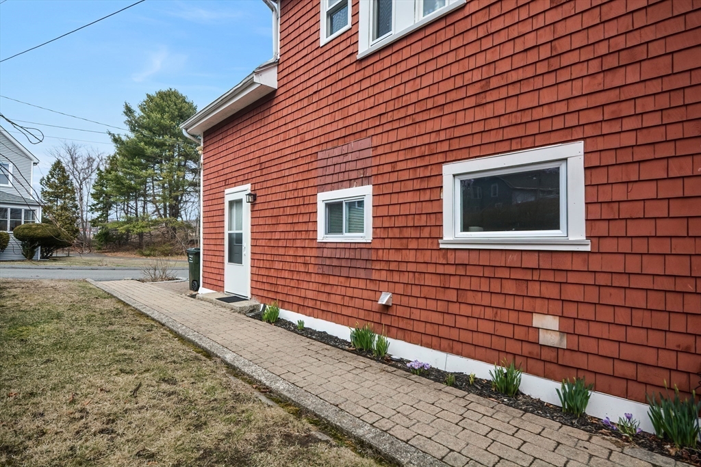21 Cemetery Street, Unit 21 Hopedale, MA 01747 - Photo 17 of 19 a front view of a house with a yard