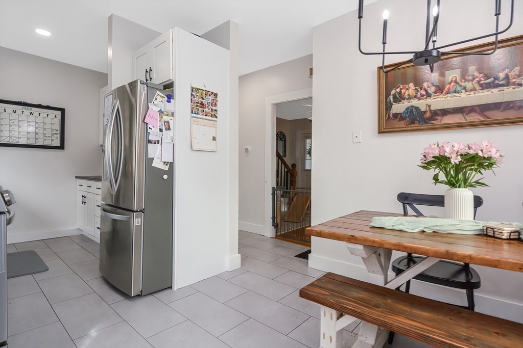 21 Cemetery Street, Unit 21 Hopedale, MA 01747 - Photo 2 of 19 a kitchen with stainless steel appliances granite countertop a refrigerator and a stove top oven