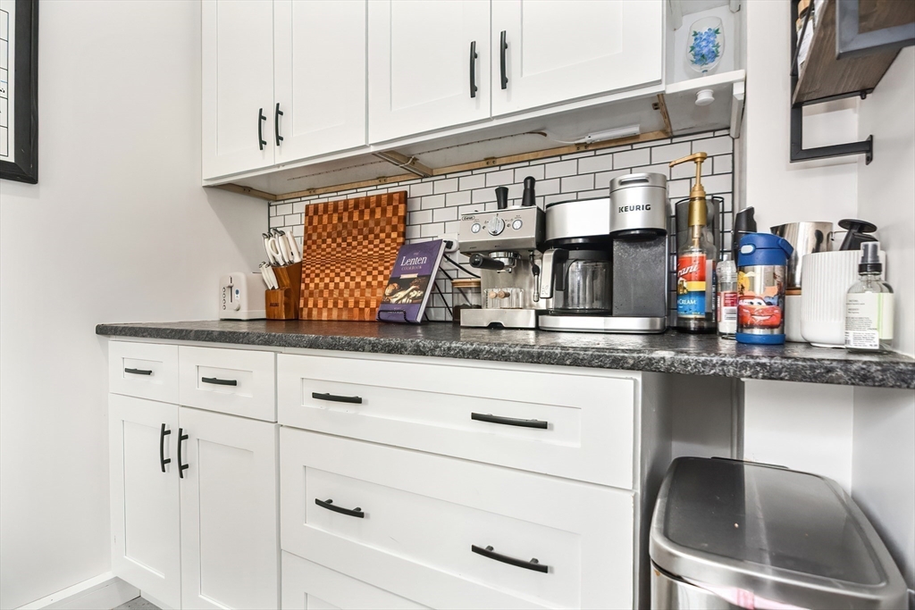 21 Cemetery Street, Unit 21 Hopedale, MA 01747 - Photo 6 of 19 a kitchen with granite countertop white cabinets and white appliances