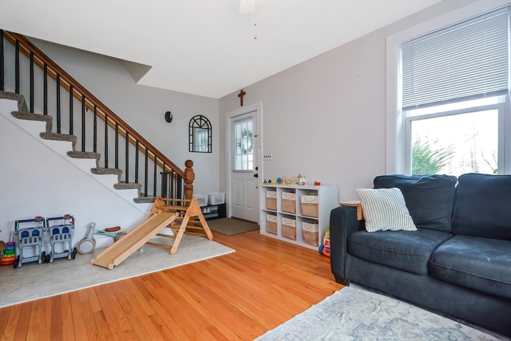 21 Cemetery Street, Unit 21 Hopedale, MA 01747 - Photo 9 of 19 a living room with furniture and wooden floor