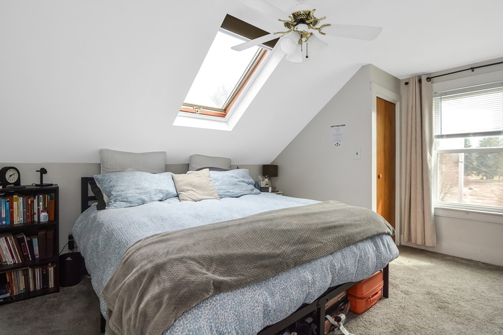 21 Cemetery Street, Unit 21 Hopedale, MA 01747 - Photo 10 of 19 a bedroom with a bed and a window