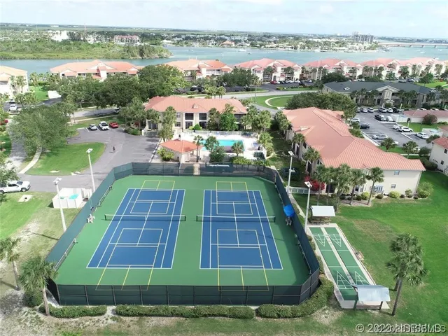 a view of a street with a sign on the wall