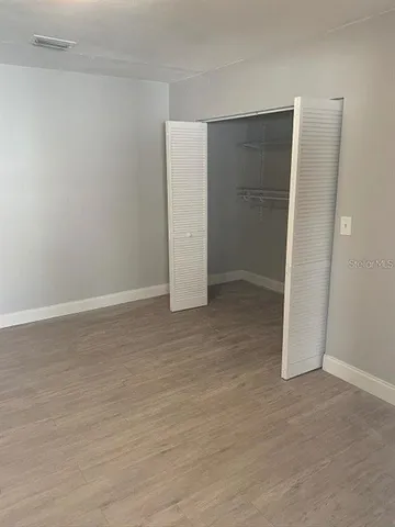 an empty room with wooden door