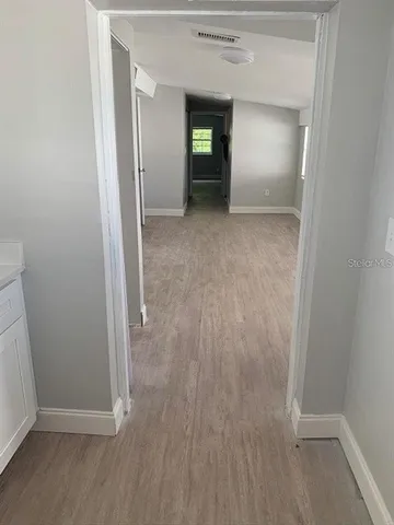 wooden floor and window in an empty room