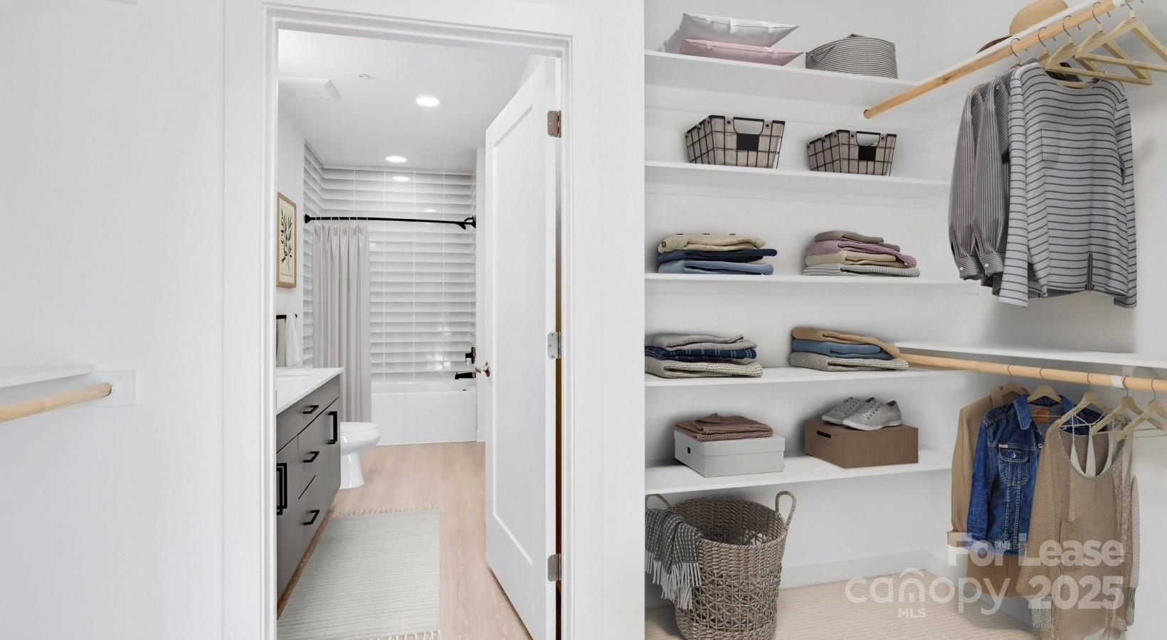 1133 Harding Place, Unit C2 Charlotte, NC 28204 - Photo 27 of 41 a view of walk in closet with clothes and shoes