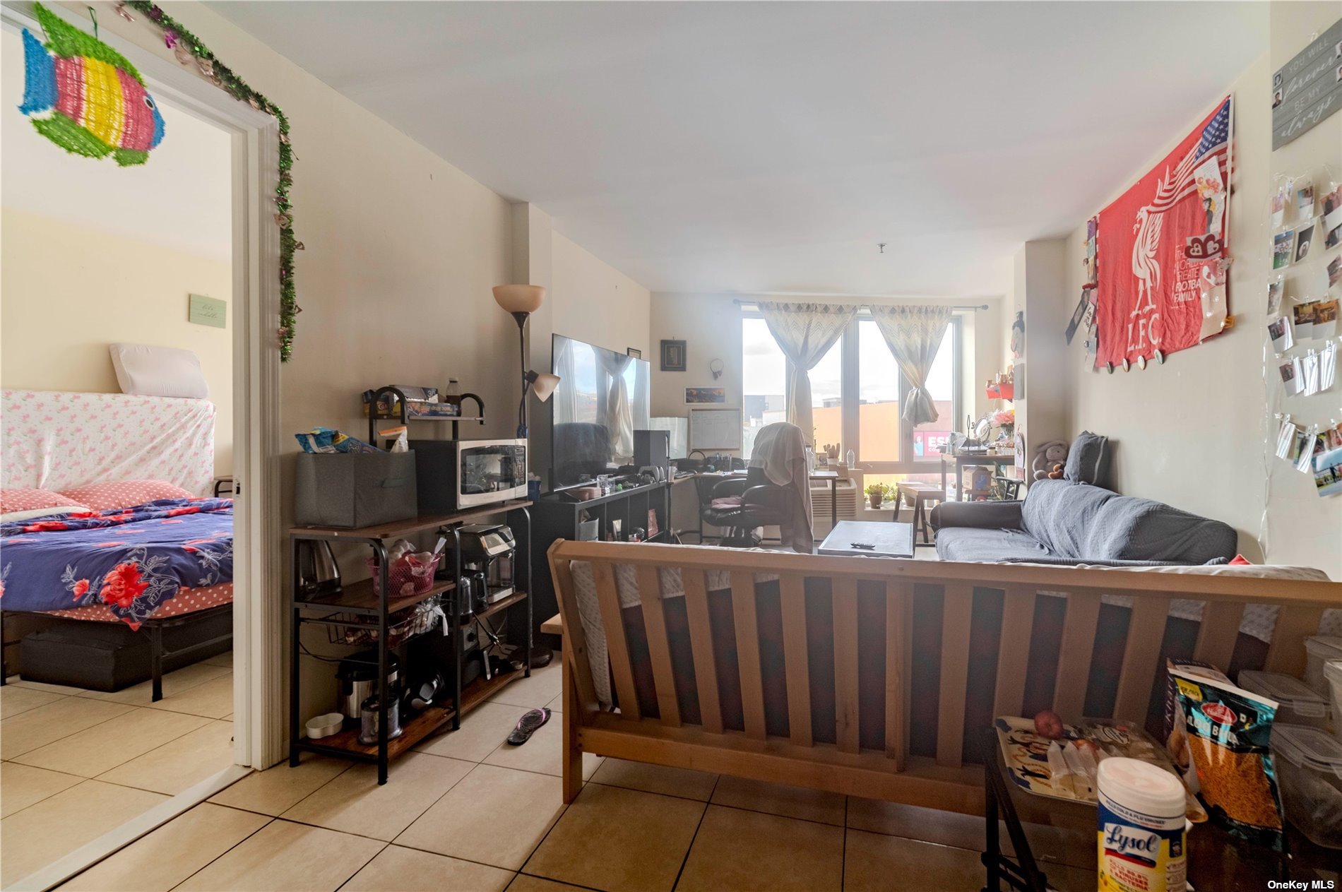 83-17 Broadway Queens, NY 11373 - Photo 18 of 27 a very nice looking room with a large window