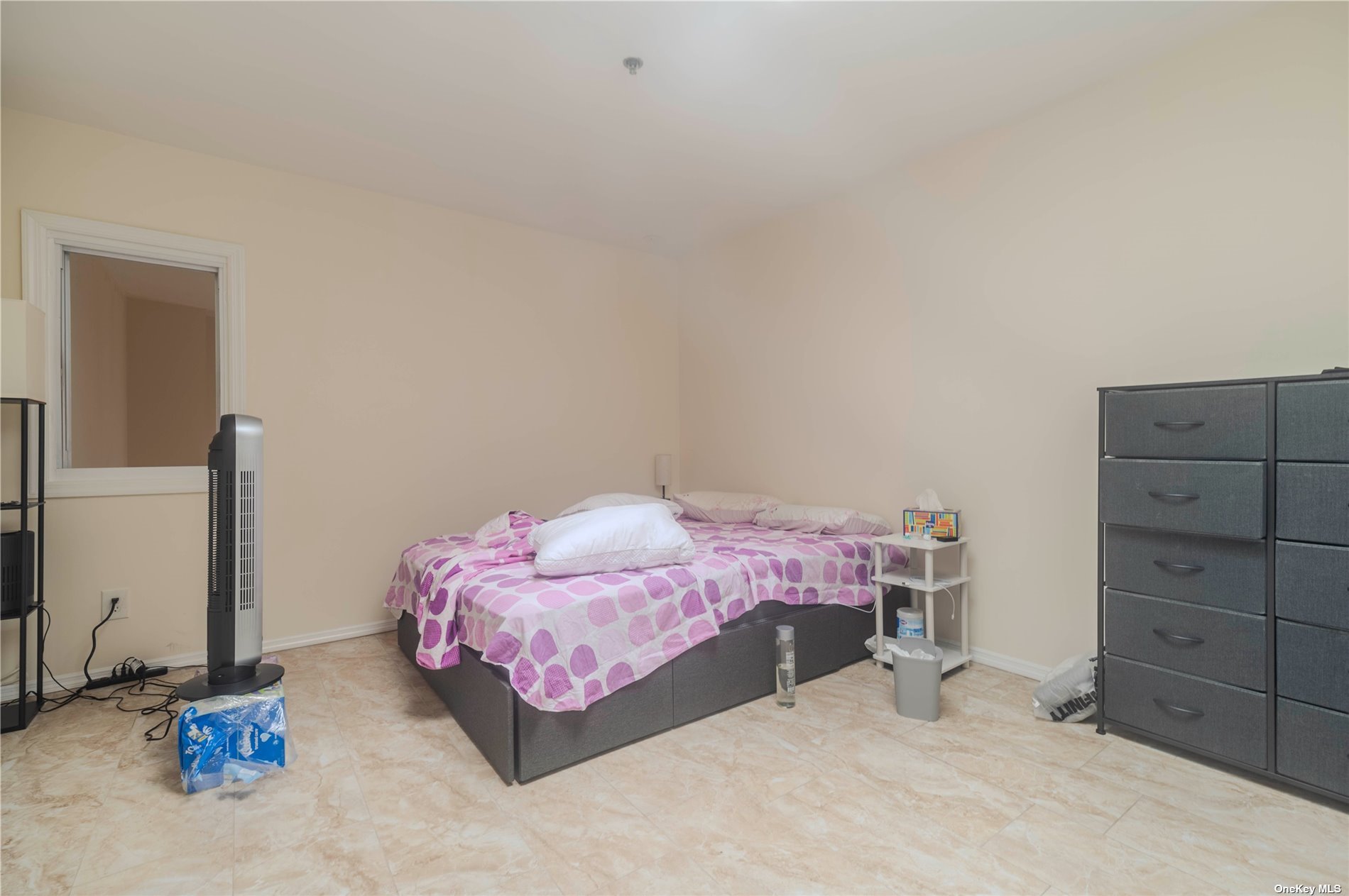 83-17 Broadway Queens, NY 11373 - Photo 21 of 27 a bedroom with a bed and a cabinets