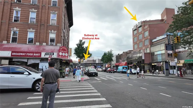 a view of a street with cars