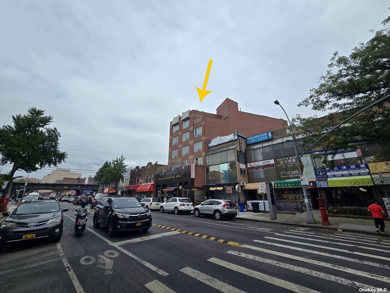 83-17 Broadway Queens, NY 11373 - Photo 4 of 27 a cars parked on the side of a street