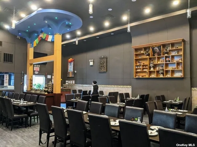 a media room with lots of chairs and a projector screen