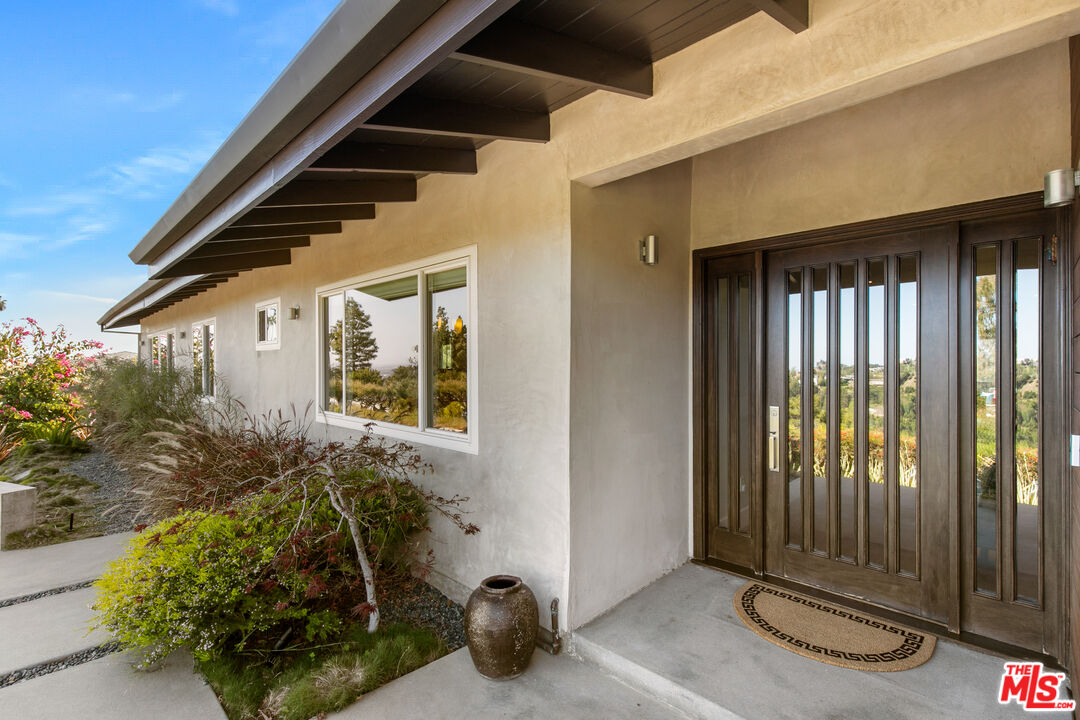 a view of a porch with seating space